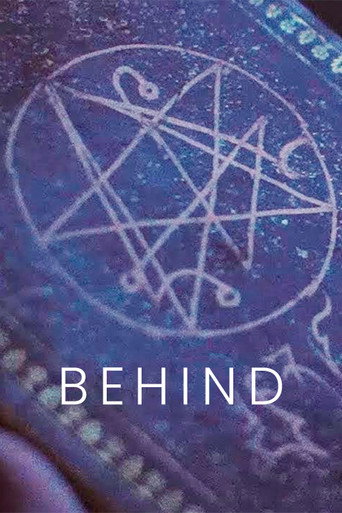 Behind movie poster